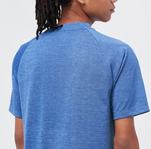 The back view of a man wearing a blue t - shirt.