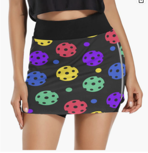 woman's pickleball skirt with bright-colored pickleball balls