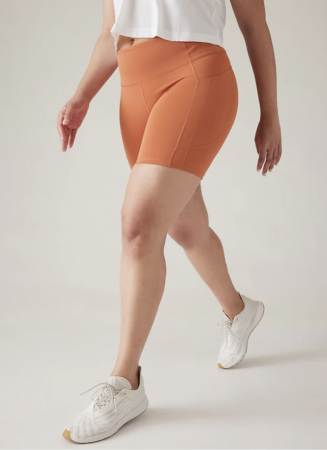 Orange, high-impact , tight, medium-length pickleball shorts for women